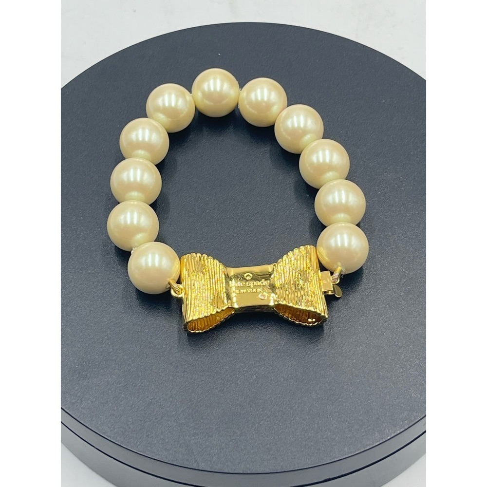 Kate Spade All Wrapped Up Pearl Gold Bow Bracelet - Picture 2 of 13